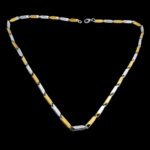 Close-up of Masculine Dual-Tone Rice Grain Necklace Links.