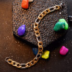 Men's two-tone gold and silver Figaro link chain bracelet