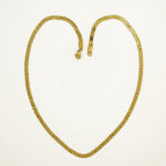 Flat snake gold necklace with embossed star detail design