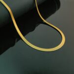 AuraSpark Gold Snake Chain Necklace on white background.