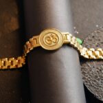 : AuraSpark gold plated Om bracelet for men with dotted detailing