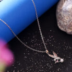 AuraSpark Silver Hummingbird Necklace with Pink Stone and Pearl.