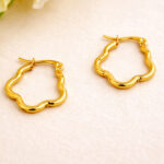 AuraSpark Gold Plated Wave Hoop Earrings on white background