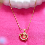 AuraSpark Gold Butterfly Heart Pendant with Pink Crystals.