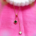 Gold clover necklace with mother of pearl and black onyx