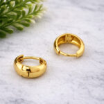 Pair of chunky high-polish gold huggie hoops for women