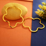 AuraSpark gold wavy hoop earrings with flower charm for women