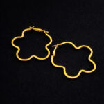 Dainty floral gold hoops, sculptural wavy design jewelry