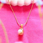 AuraSpark gold plated pearl moon pendant on snake chain.