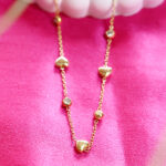 AuraSpark Gold Heart and Crystal Station Necklace for Women.