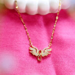 Women's gold guardian angel pendant with infinity symbol.
