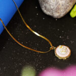 AuraSpark Gold Starfish Pendant with Pink Enamel and Pearl