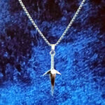 Close-up of Polished Stainless Steel Dagger Charm for Men