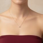 AuraSpark Gold Bow Necklace with Sparkling Heart Crystals