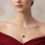 Gold clover necklace with mother of pearl and black onyx