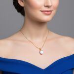 Elegant gold plated ball charm necklace for formal ladies wear.