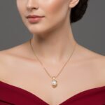 Gold crescent moon necklace with white pearl for women.