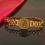 Close-up of circle and dotted engravings on Om bracelet for men.