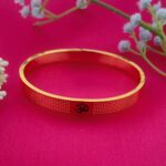 AuraSpark spiritual Om bangle in 18K gold finish.
